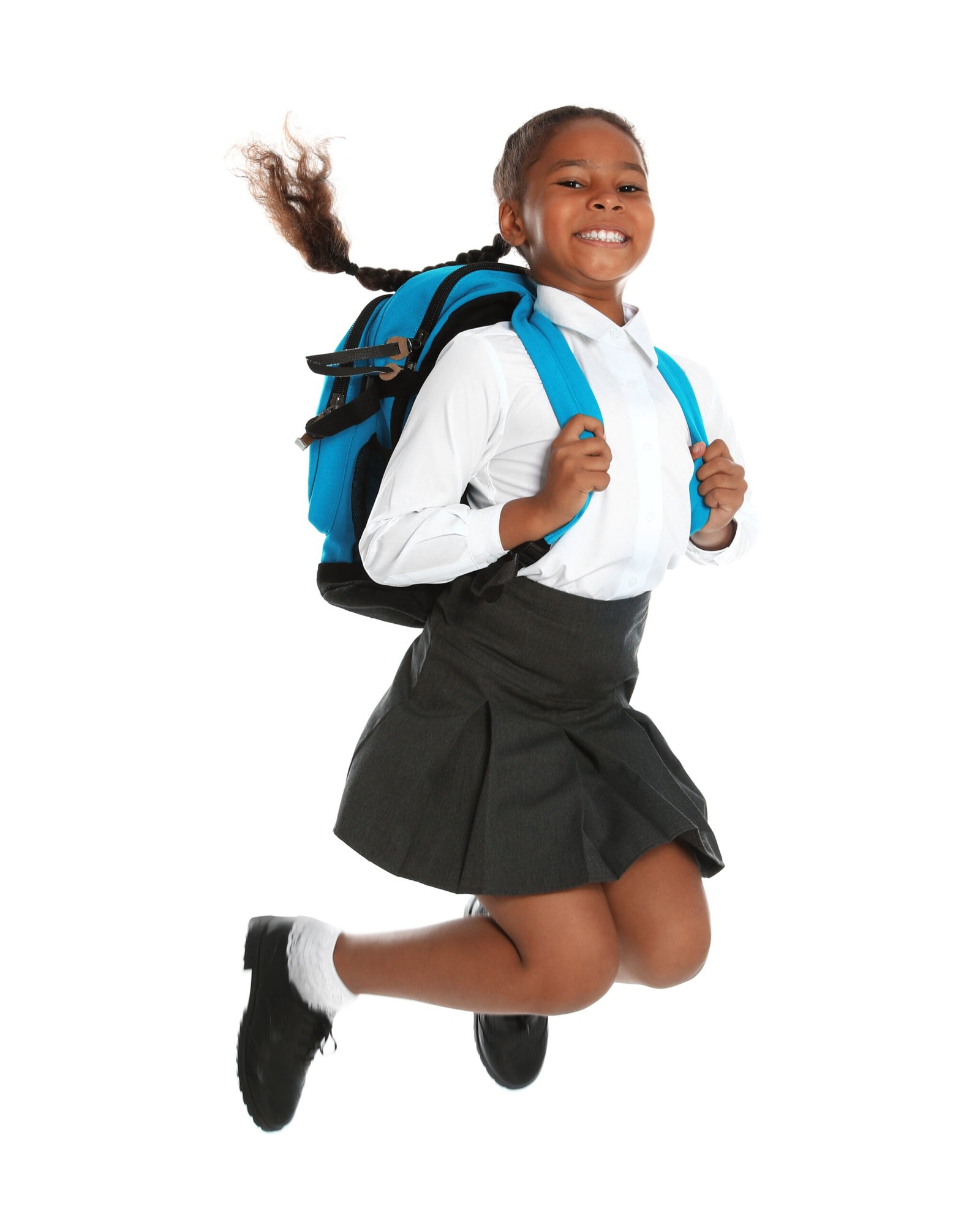 Happy,African-american,Girl,In,School,Uniform,Jumping,On,White,Background